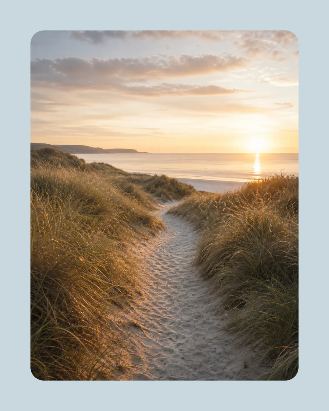 Portrait coastal photograph placed inside a wide rounded pale blue border